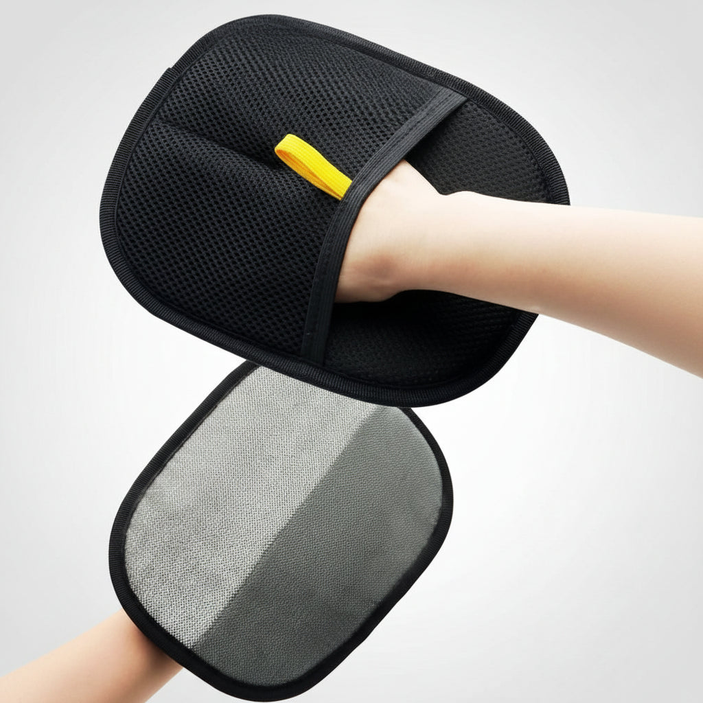 Black and gray cushion with a yellow tag held by a person against a blurred background